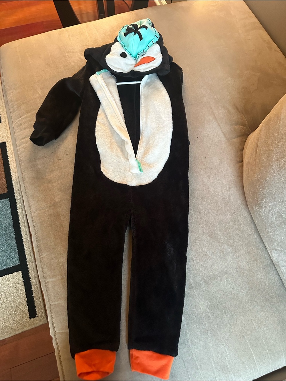 North Pole Trading Co. Kids Penguin One-Piece Hooded Pajamas with Orange Cuffs